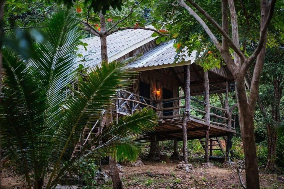 a tree house in the middle of the forest at Simple Life Bungalows in Ko Jum