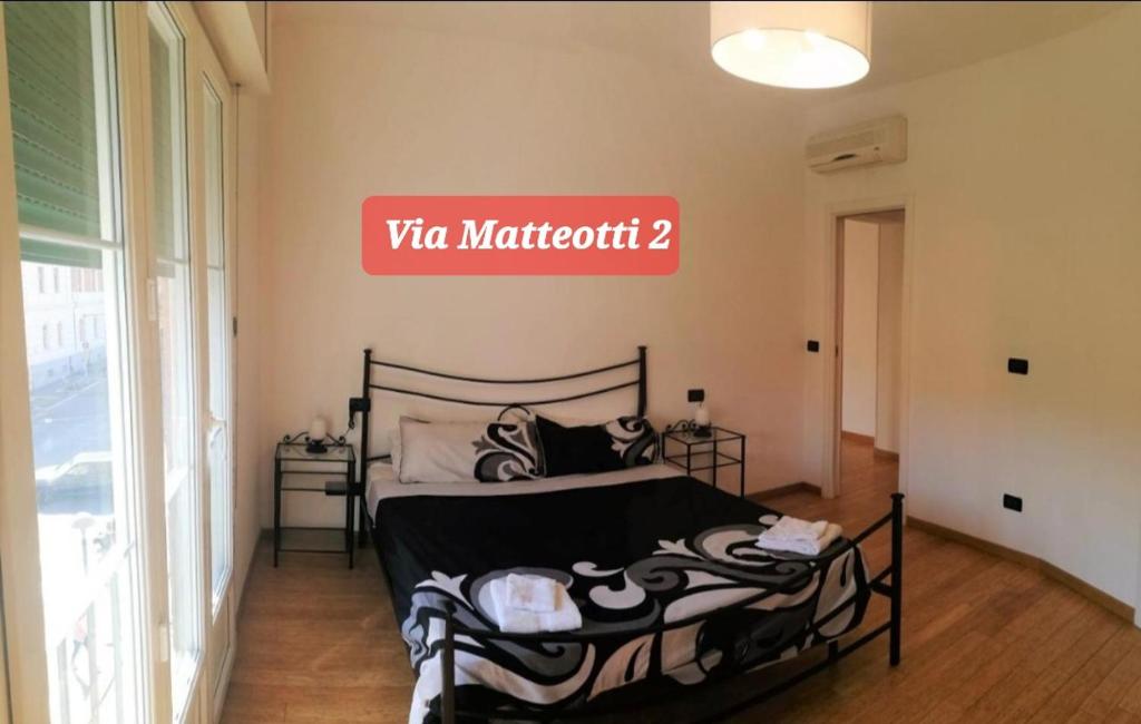 Posteľ alebo postele v izbe v ubytovaní Via Matteotti & Via Carracci Apartments