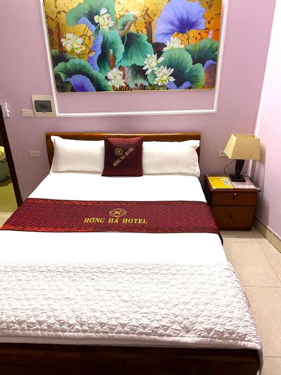 Postel nebo postele na pokoji v ubytování Hong Ha Airport Hotel