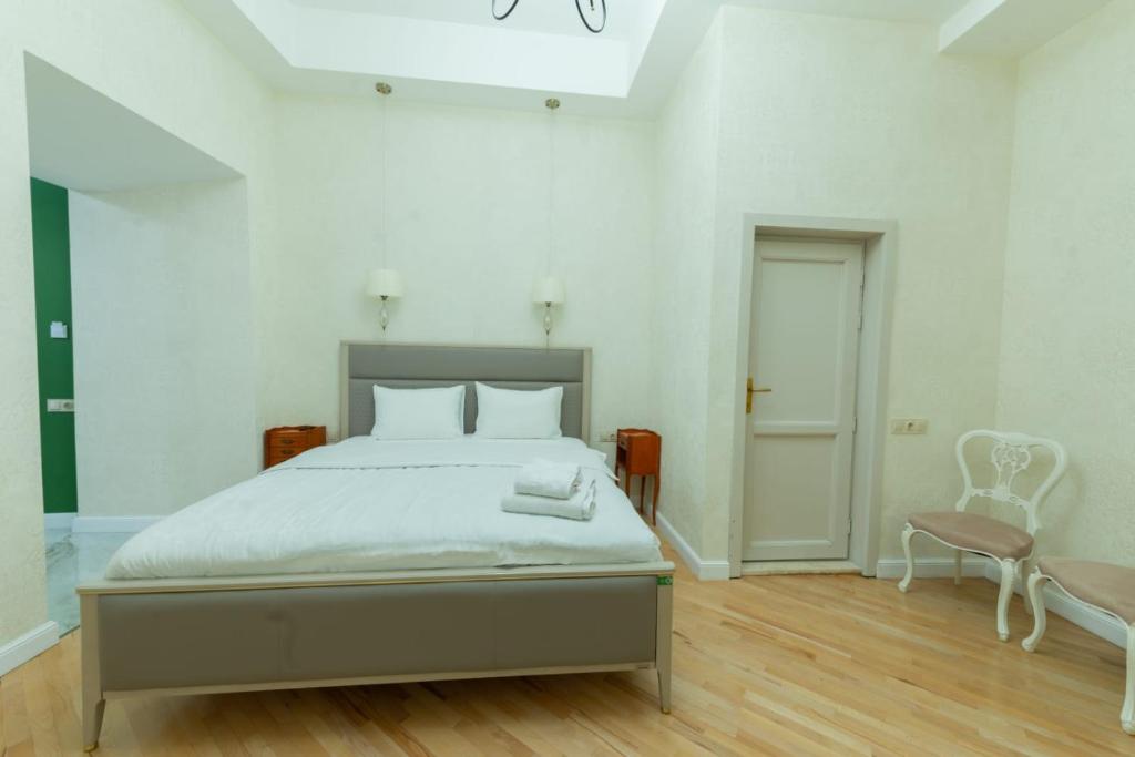 Postel nebo postele na pokoji v ubytování Marita Hotel