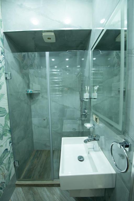 Koupelna v ubytování Marita Hotel