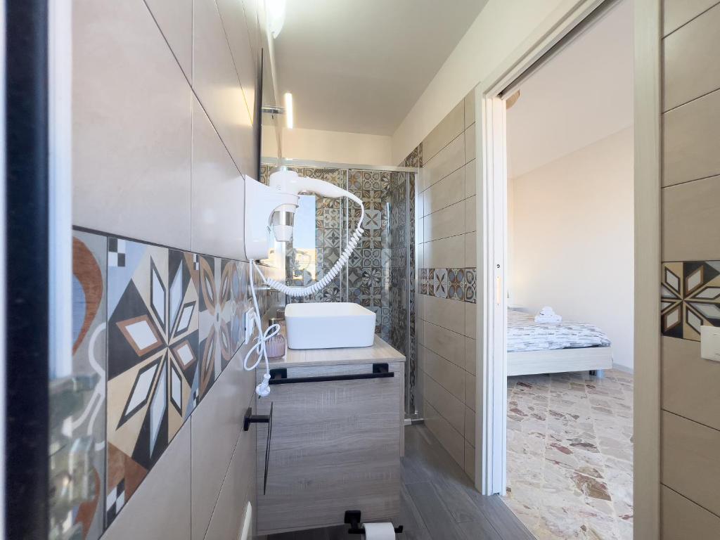 Ένα ή περισσότερα κρεβάτια σε δωμάτιο στο Ponente & Maestro Rooms