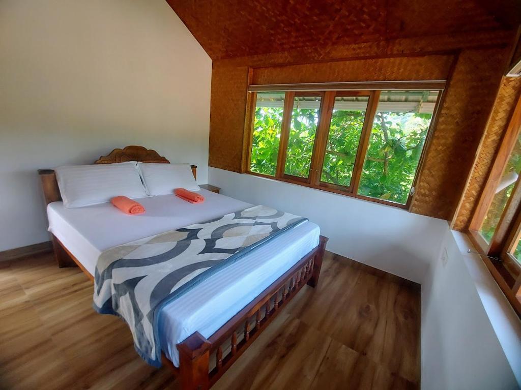 Postel nebo postele na pokoji v ubytování Sherly Cottages