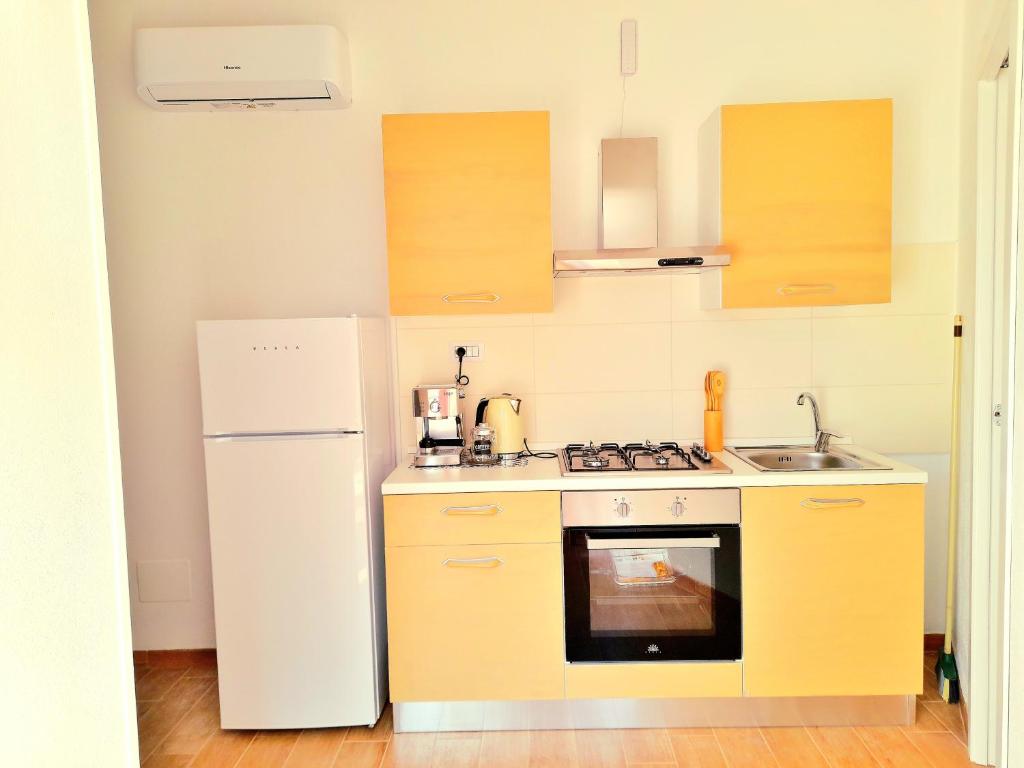 Kuchyň nebo kuchyňský kout v ubytování casa vacanze gioema baunei