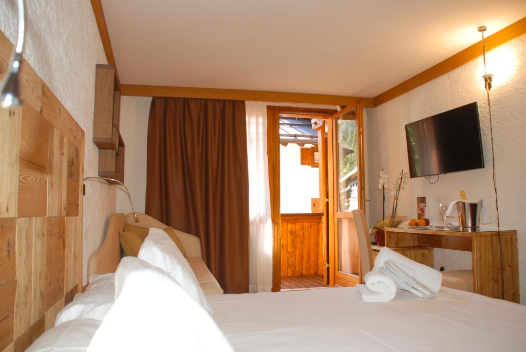 Postel nebo postele na pokoji v ubytování Style Hotel Grifone