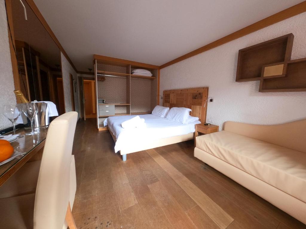 Postel nebo postele na pokoji v ubytování Style Hotel Grifone