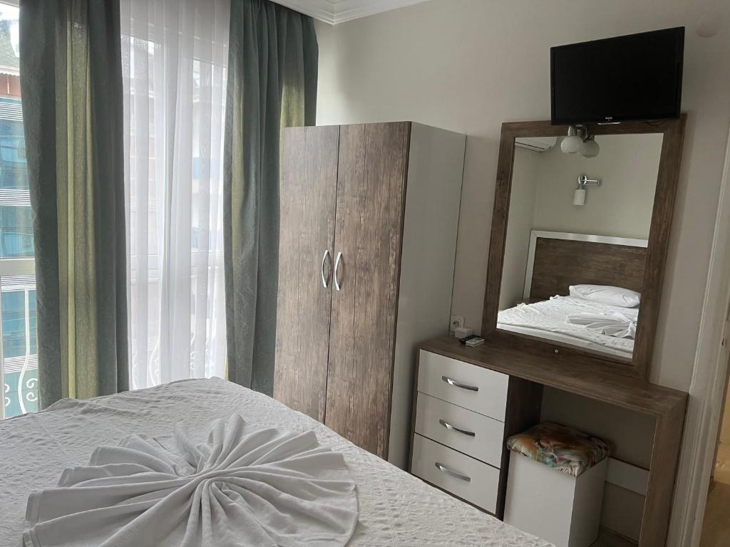 A bed or beds in a room at Cleopatra King Apart