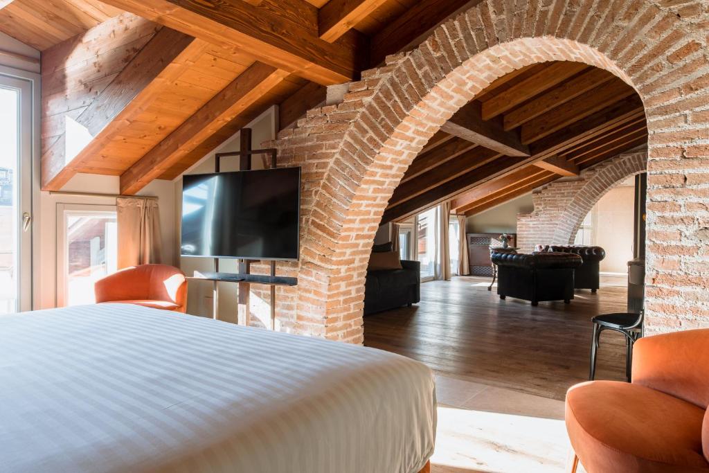 TV a/nebo společenská místnost v ubytování Pavillon Suite