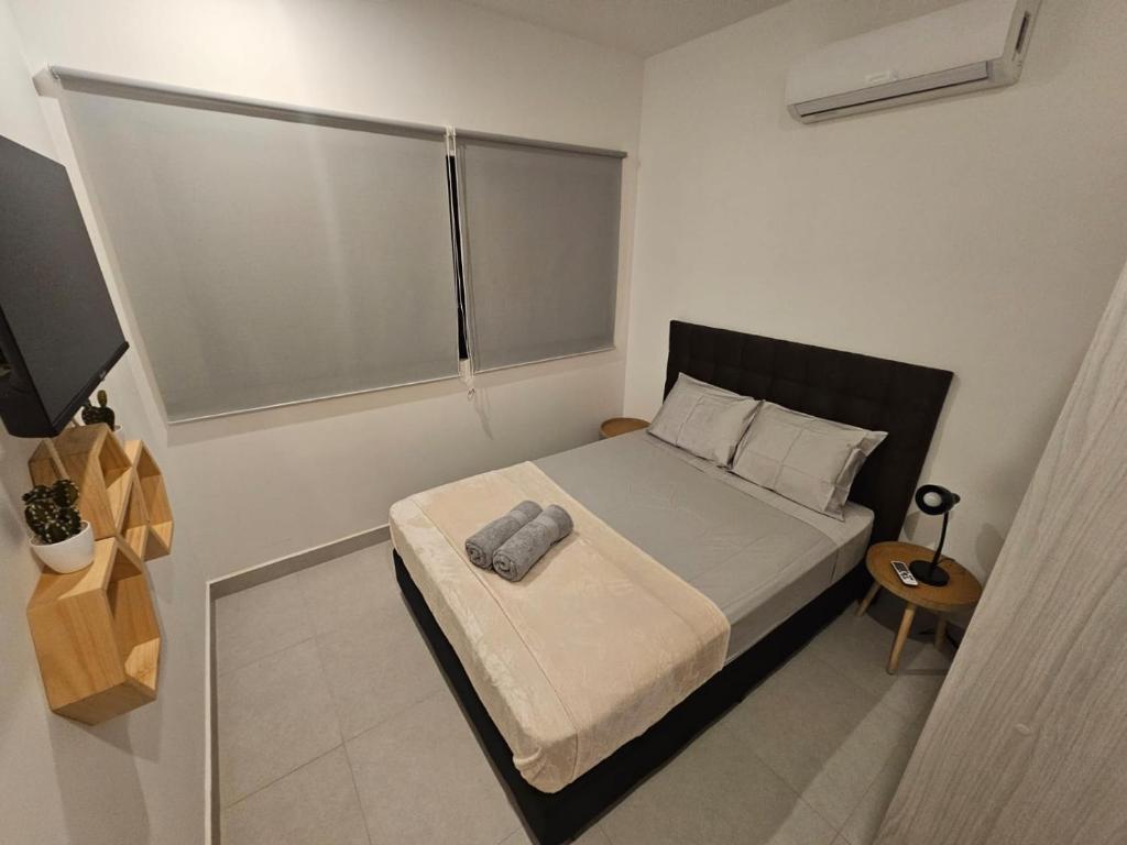 Postel nebo postele na pokoji v ubytování Muna Santa Rosa Apartamentos