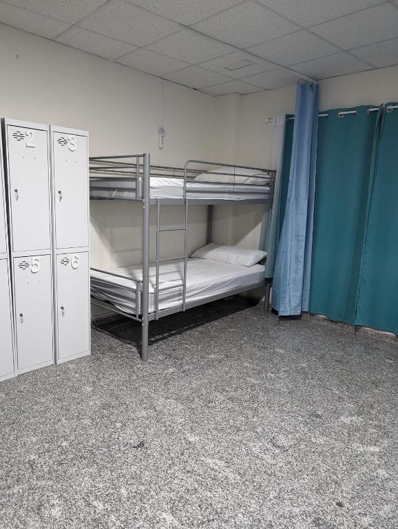 Postel nebo postele na pokoji v ubytování Hoomy Hostel