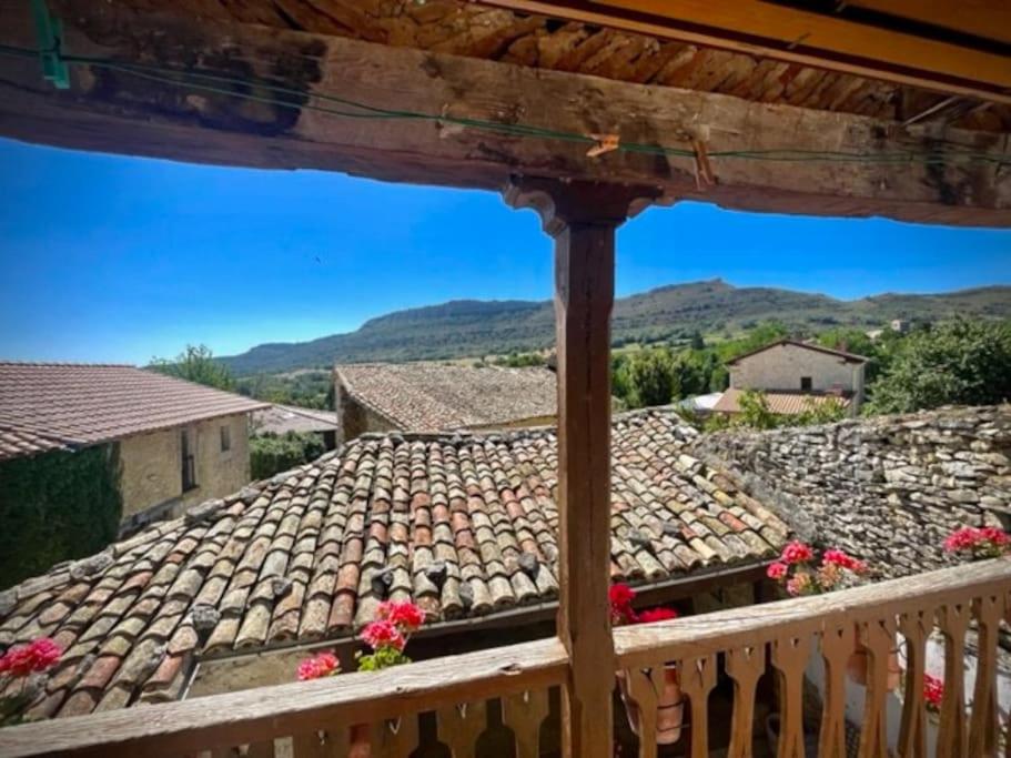 a view from the balcony of a house with a tile roof at Encantadora casa de pueblo 