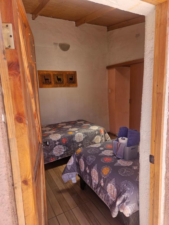 Postel nebo postele na pokoji v ubytování Hostal Likancabur