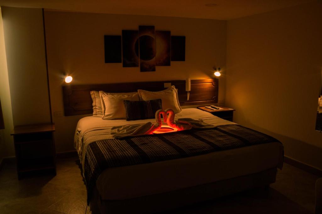 Postel nebo postele na pokoji v ubytování Hotel Estación Sabana