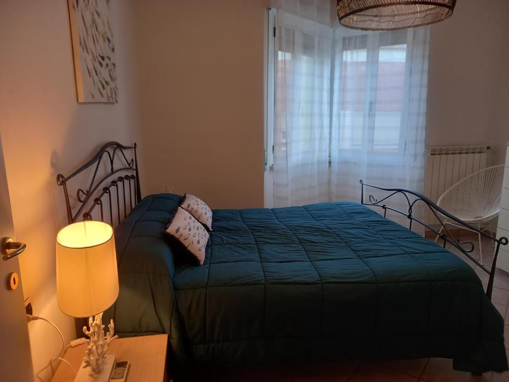 Postel nebo postele na pokoji v ubytování BILOCALE VIA CURZI centralissimo