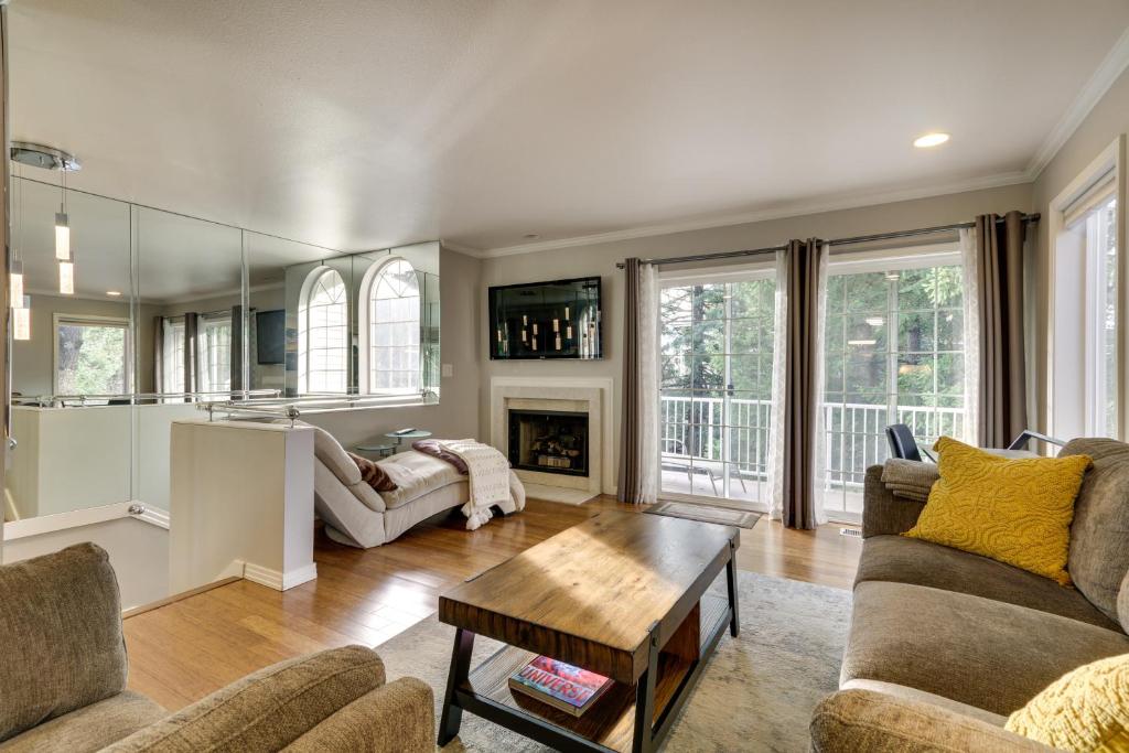 a living room with two couches and a fireplace at Lake Oswego Home with Deck 9 Mi to Downtown Portland in Lake Oswego