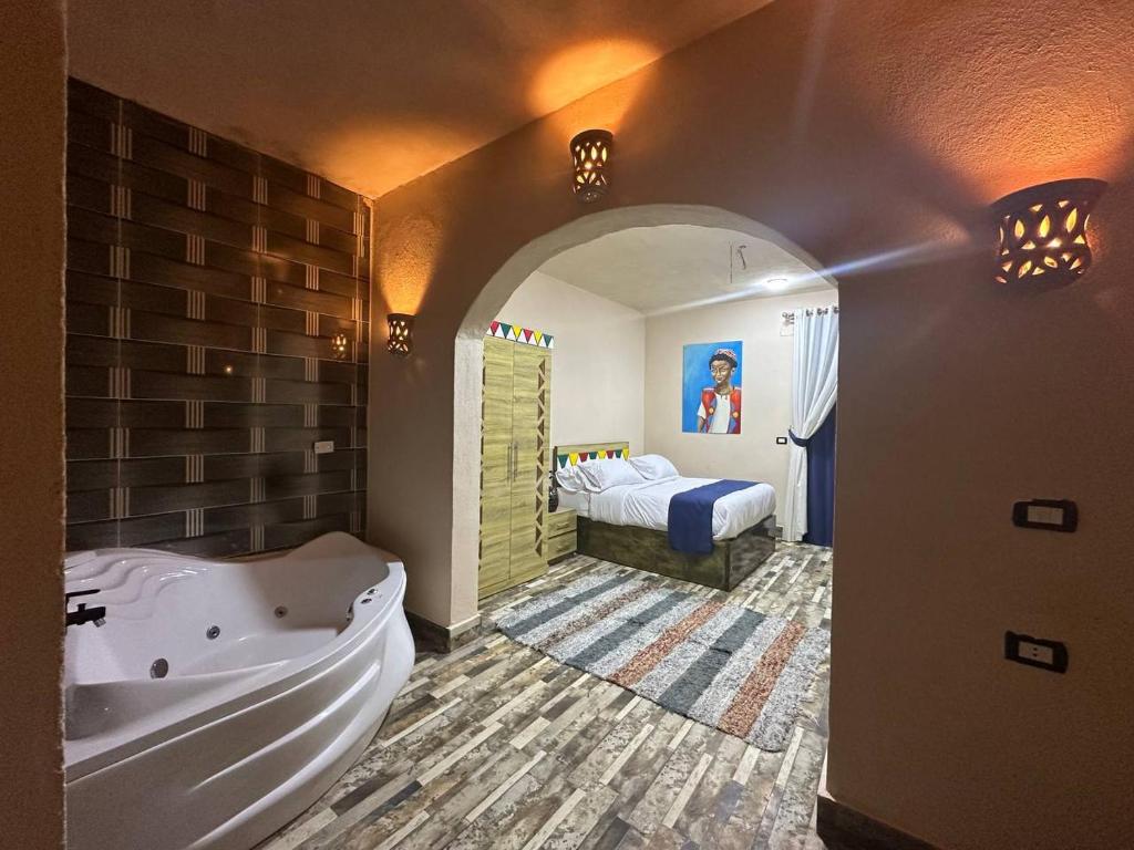 Postel nebo postele na pokoji v ubytování ACHERTOD Nubian House