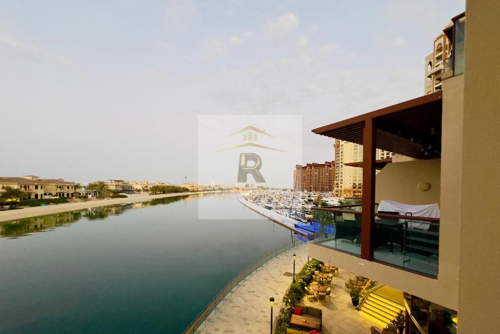 a view of a river from a building with a sign at Palm View East Jumeira - Studio Apartment in Dubai