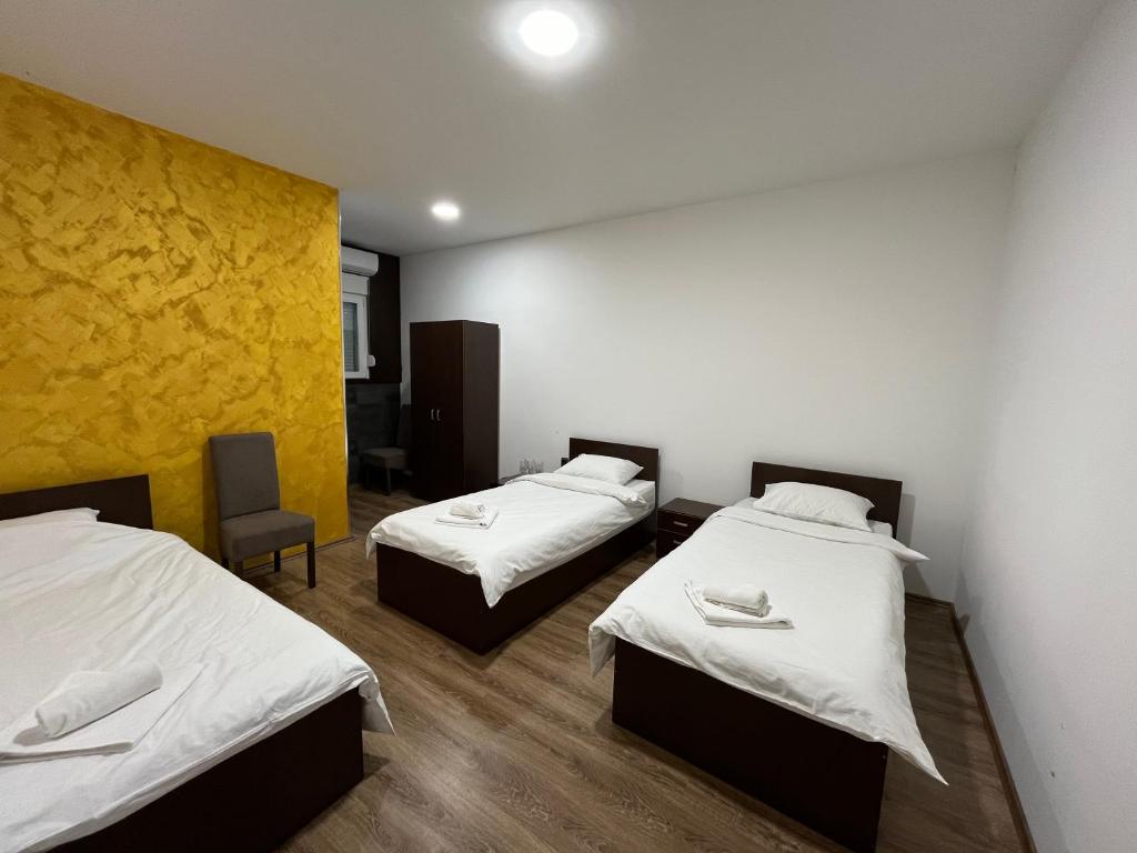 Postel nebo postele na pokoji v ubytování Apartmani Bosfor