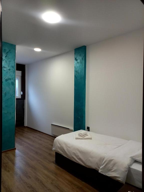 Postel nebo postele na pokoji v ubytování Apartmani Bosfor