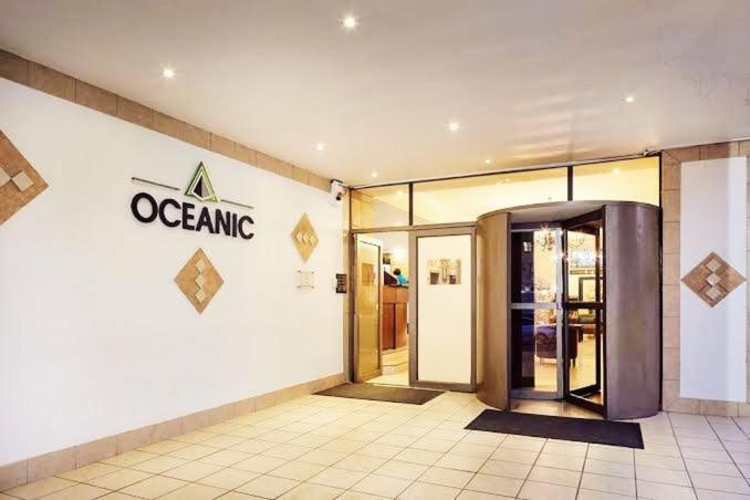 a store front with an opening sign on a building at Exclusive Stays @ Rea's Oceanic Hotels in Durban