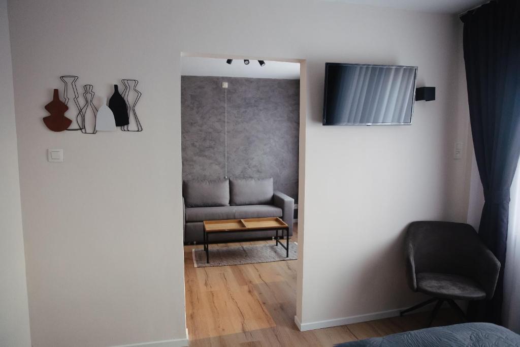 TV a/nebo společenská místnost v ubytování MD luxury