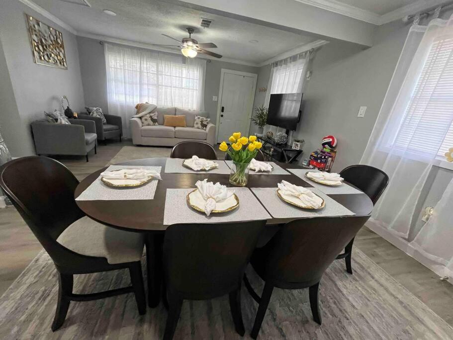 a living room with a dining room table with chairs at Home in Hempstead in Hempstead