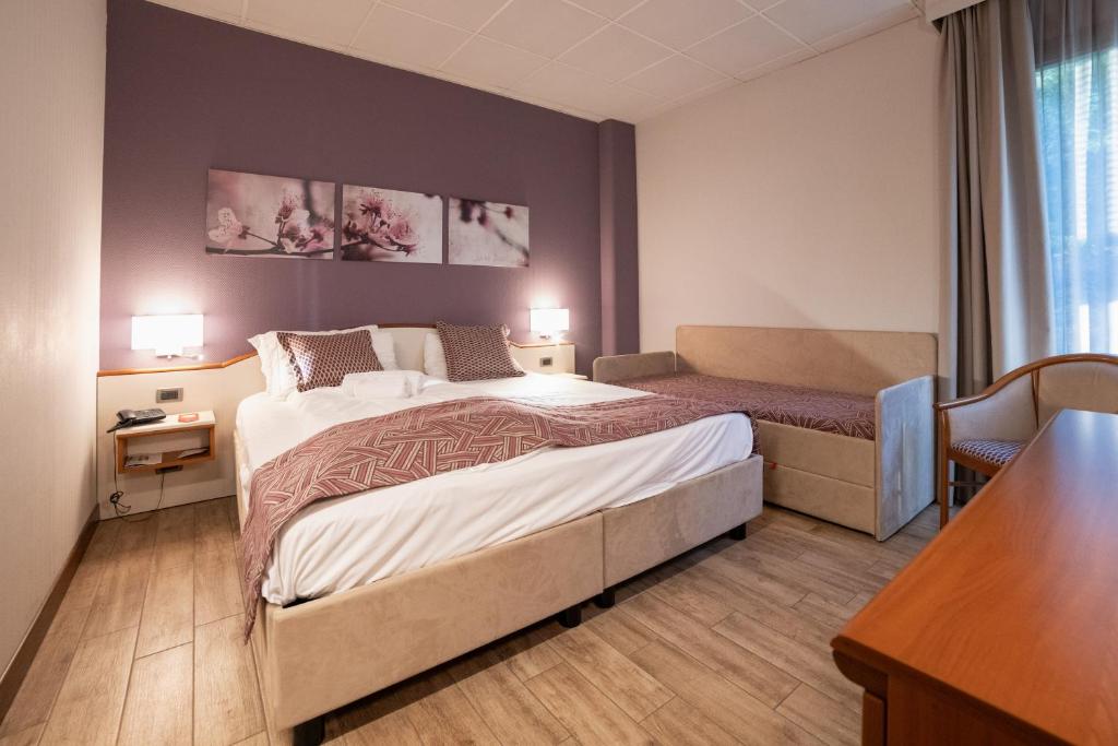 Łóżko lub łóżka w pokoju w obiekcie Hotel all'Orso