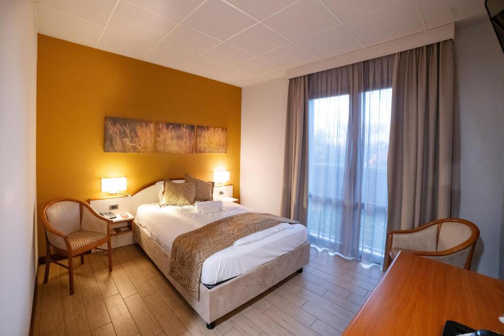 Łóżko lub łóżka w pokoju w obiekcie Hotel all'Orso