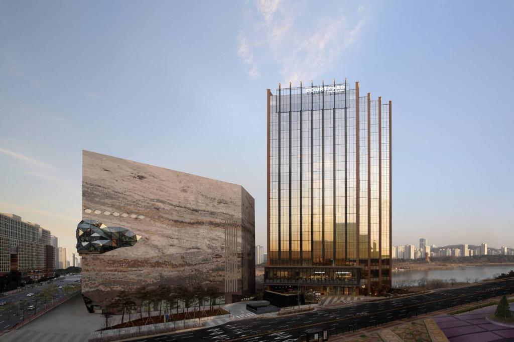 a rendering of a building next to a tall building at Courtyard by Marriott Suwon in Suwon