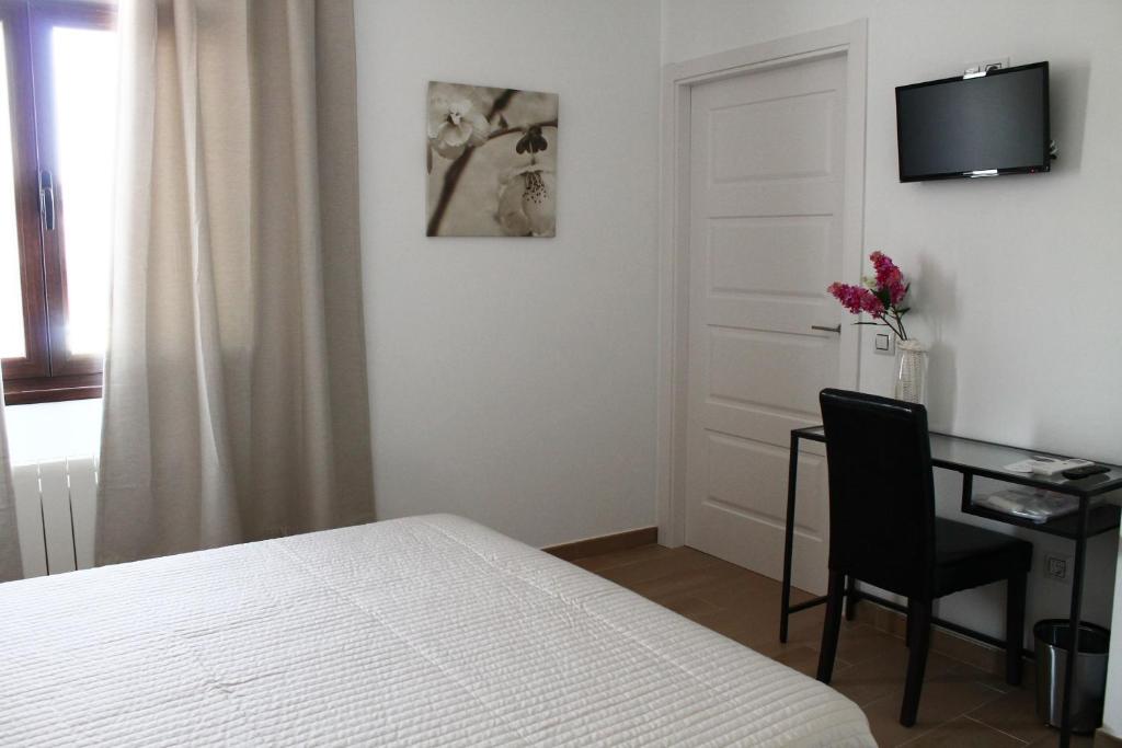Postel nebo postele na pokoji v ubytování Hostal Landhaus