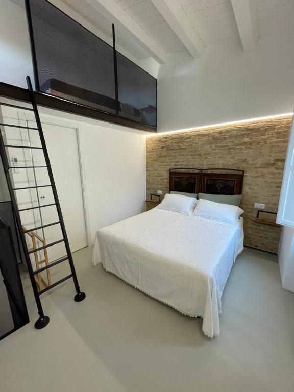 Postel nebo postele na pokoji v ubytování Al Civico 2 tiny house