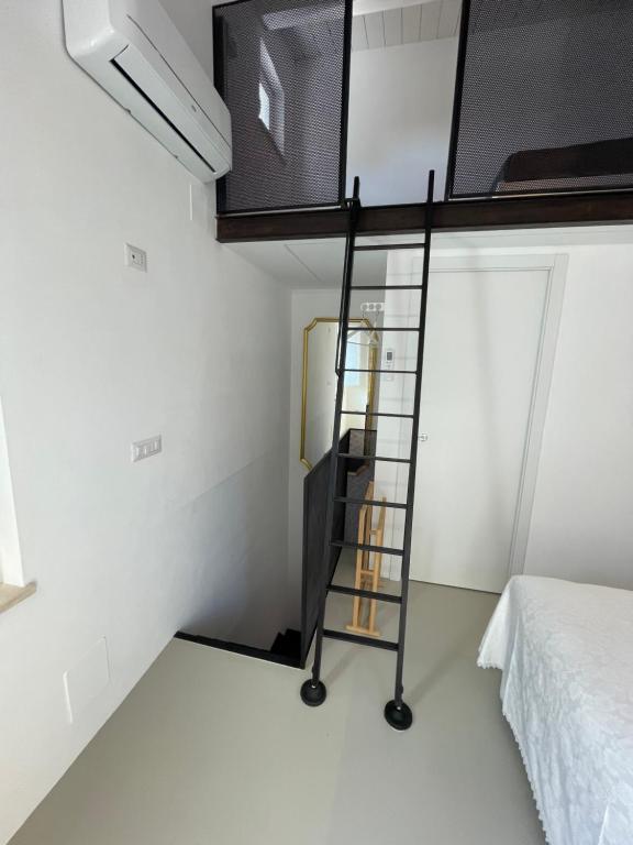 Postel nebo postele na pokoji v ubytování Al Civico 2 tiny house