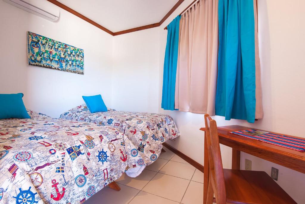 Postel nebo postele na pokoji v ubytování Hotel Los Corales