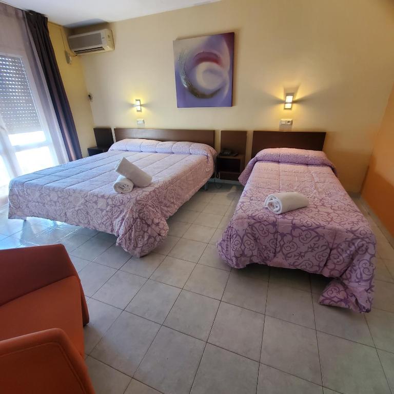 Postel nebo postele na pokoji v ubytování Ampuria Inn