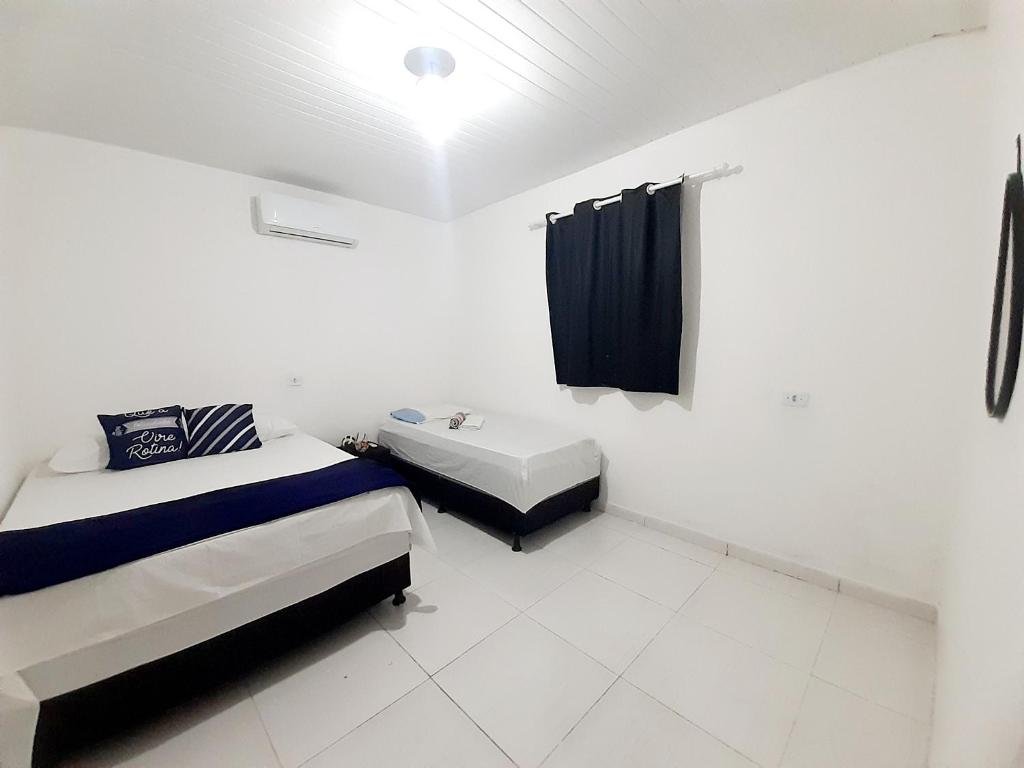 Postel nebo postele na pokoji v ubytování Pousada Aconchego Sol e Mar