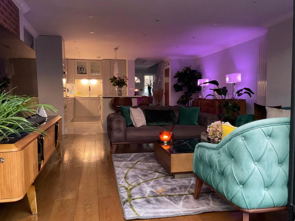 a living room with a couch and a table at Simply relax in London