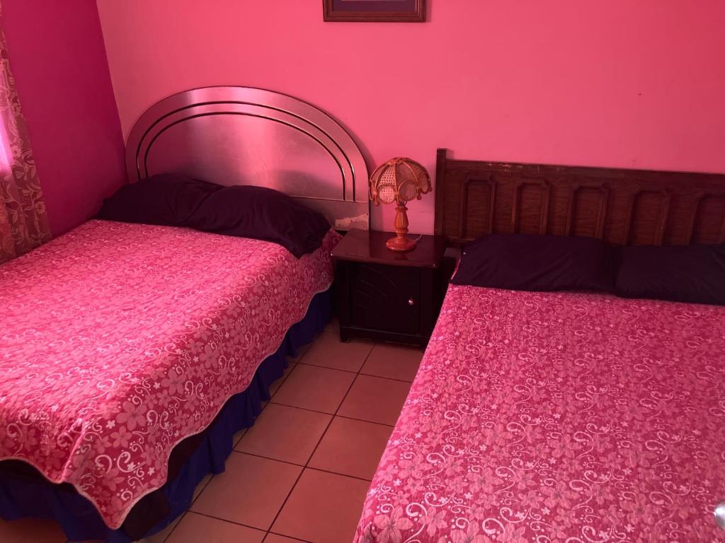 Postel nebo postele na pokoji v ubytování Blanquita Apartment