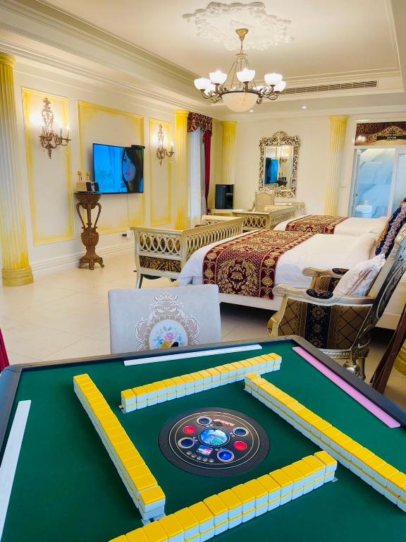 a hotel room with a pool table and a bedroom at Jane Castle in Wujie