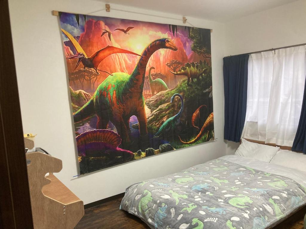 Postel nebo postele na pokoji v ubytování 11月フルリフォーム 12月オープン恐竜一色ゲストハウスDinosaur Guesthouse