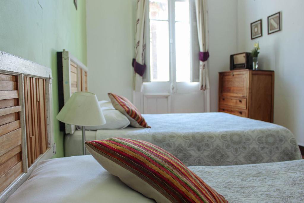 Postel nebo postele na pokoji v ubytování Nómada Eco-Hostal