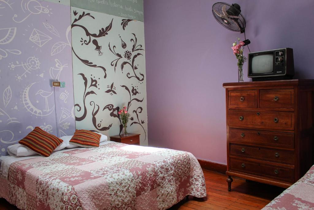 Postel nebo postele na pokoji v ubytování Nómada Eco-Hostal
