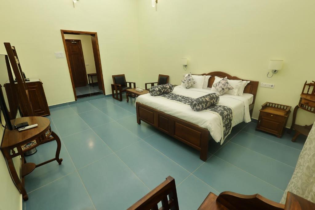 Postel nebo postele na pokoji v ubytování Le Colonial Suites