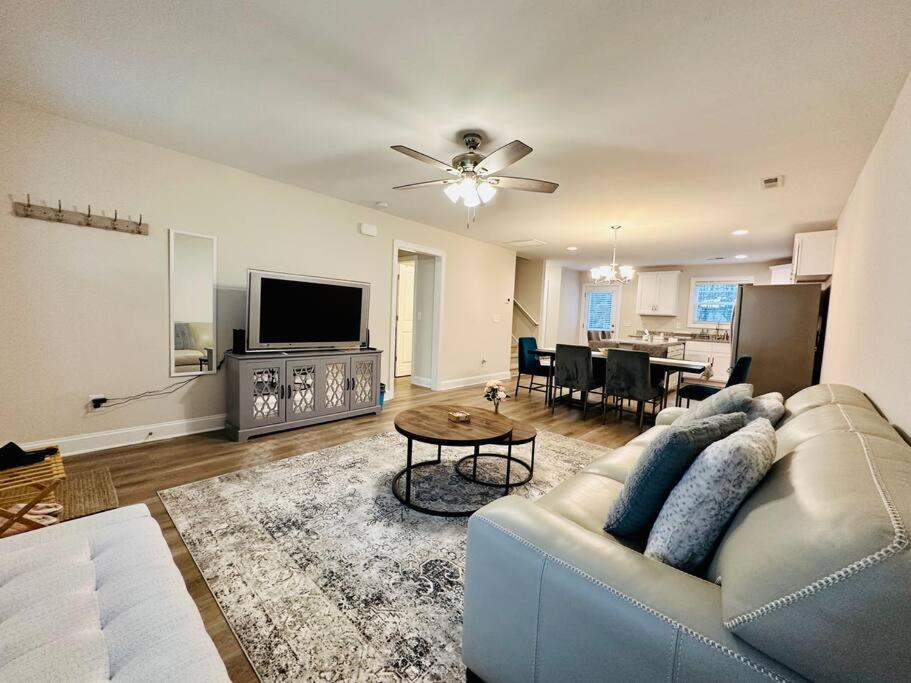 a living room with a couch and a table at SHARED HOUSE Bedroom for rent SEPARATELY Brand NEW Home! in Gastonia