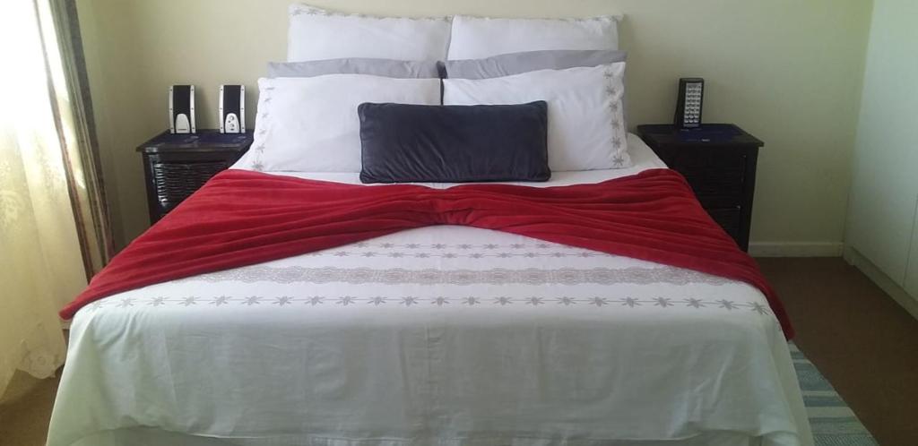 a bed with two pillows on top of it at Saldanha BLUEWATER BAY APARTMENT in Saldanha