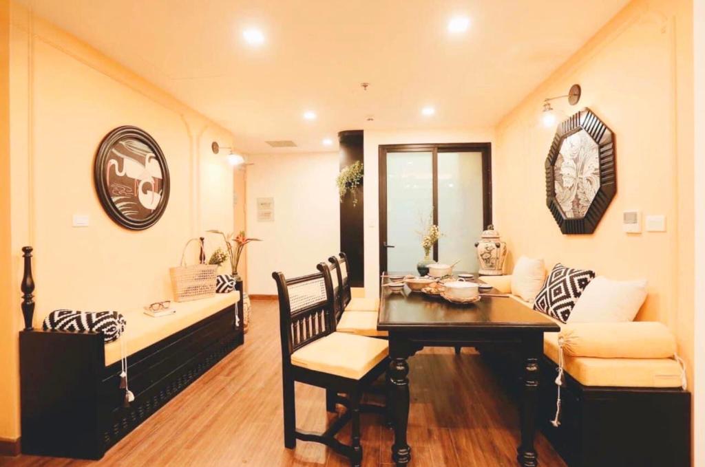 a living room with a table and a couch at FLC Luxury Apartment Quy Nhon in Quy Nhon