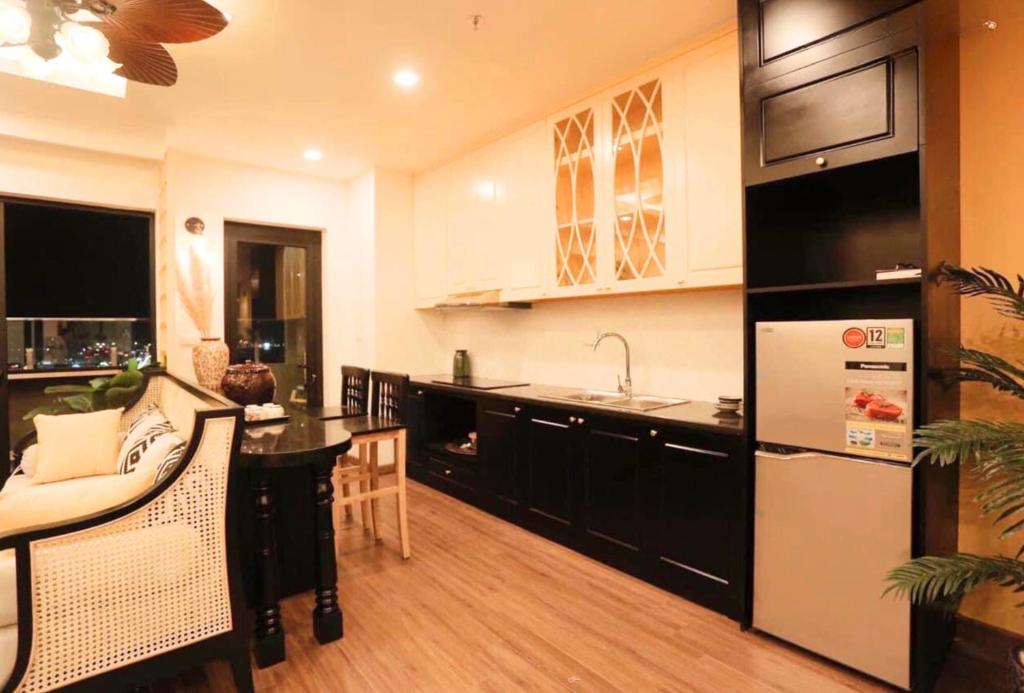 a kitchen with a sink and a counter top at FLC Luxury Apartment Quy Nhon in Quy Nhon