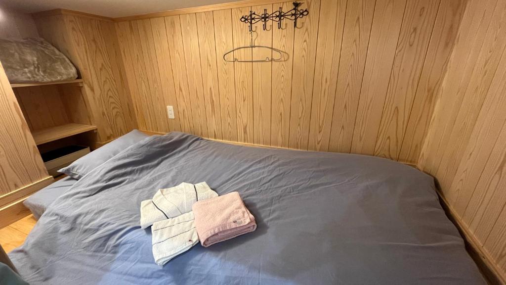 Postel nebo postele na pokoji v ubytování オレンジの風