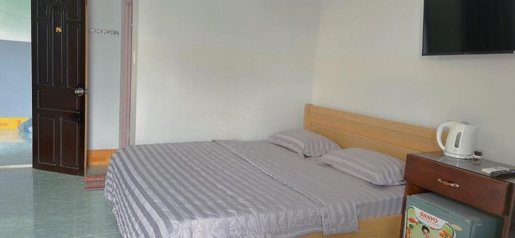 Postel nebo postele na pokoji v ubytování Hotel Minh Vy