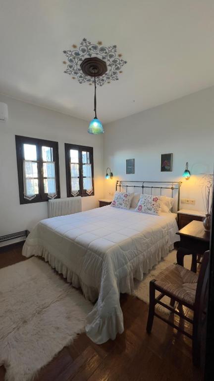 Postel nebo postele na pokoji v ubytování Guesthouse Filokalia