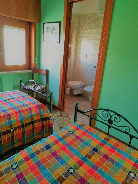 Postel nebo postele na pokoji v ubytování Case per vacanze La Fiaba